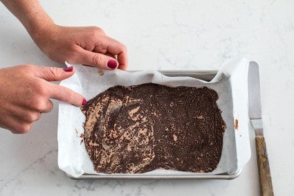 A small tray of melted chocolate that has bloomed