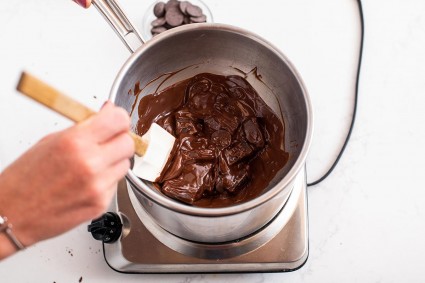 Chocolate wafers in a double boiler that have started to melt