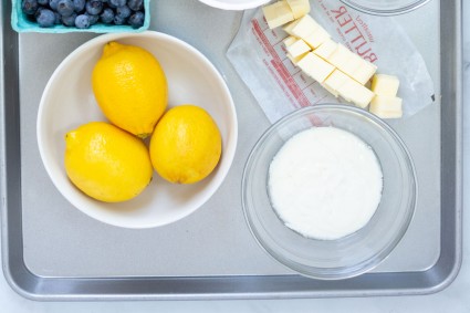 Bowl of lemons next to bowl of yogurt