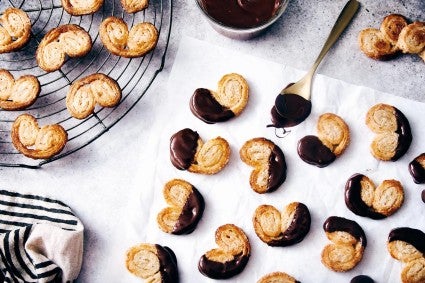 Rye palmiers partially dipped into tempered chocolate