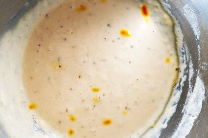 Jalebi batter with slight bubbles after overnight fermentation