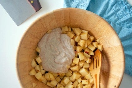 Bowl of diced apples with sour cream added to make tart filling