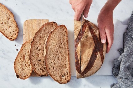 Slicing a loaf of Honey-Beer Miche