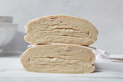 A cross-section showing laminated dough with more folds and more layers