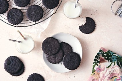 Chocolate Wafer cookies, some on a plate, some on a cooling rack.