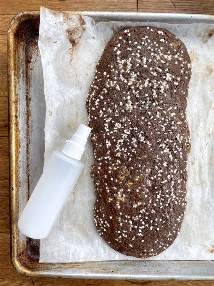 Malted Brownie Biscotti log baked, ready to be sprayed with water prior to slicing.