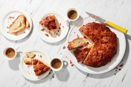 Kouign-amann sliced and served with coffee