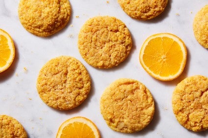 Orange Olive Oil Sugar Cookies next to slices of oranges