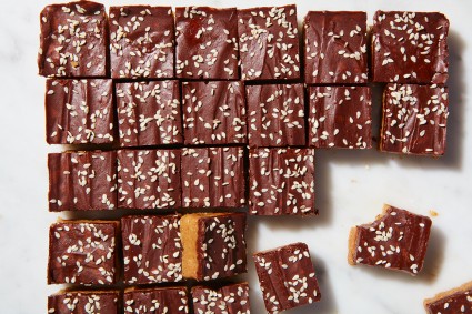 Tahini Chocolate Bars cut into slices with sesame seeds sprinkled on top