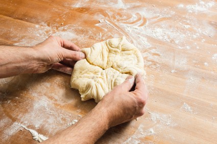 Shaping kouign-amann dough into a round