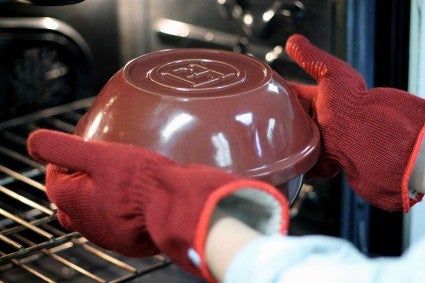 Placing bread pot in the oven