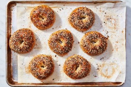 Sheet pan of baked Ultimate Sandwich Bagels with everything bagel topping