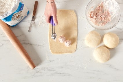 A rectangle of wool roll dough with cream cheese filling