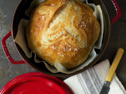 No-knead crusty white bread baked in a red Dutch oven