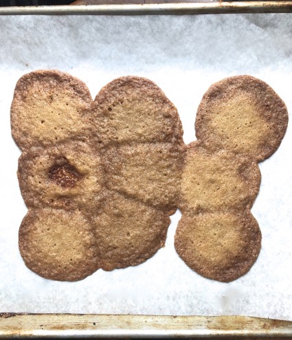 Ginger cookies on a parchment-lined baking sheet melted into a big blob as they baked.