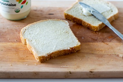 Bread slices spread with mayonnaise