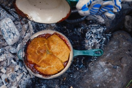 Fruit cobbler baked over a campfire