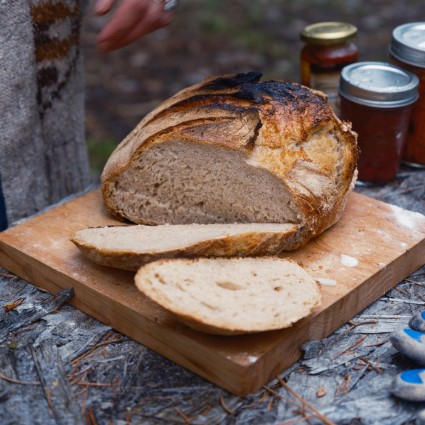 Sliced sourdough loaf that's been baked over a campfire 