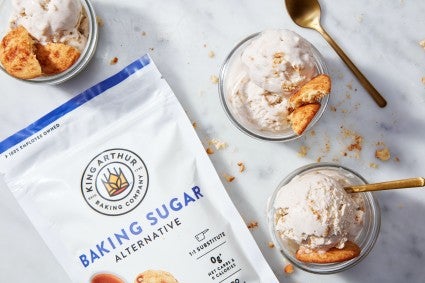 Snickerdoodle ice cream scoops made with baking sugar alternative next to the BSA package