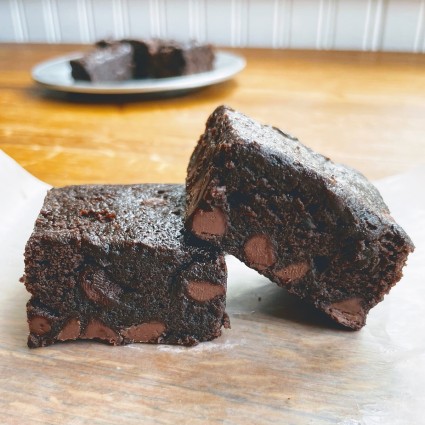 Fudge Brownies showing chocolate chips sunken into a layer at the bottom.
