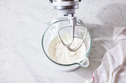 Stand mixer being used to whip cream 