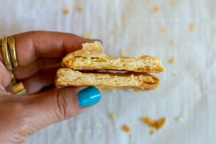 Small square of fraisage crust next to regular crust to show flakiness  