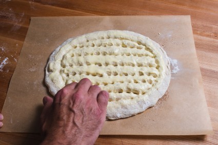 Fingers dimpling matnakash dough