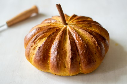 Baked pumpkin bread with cinnamon stick for a stem