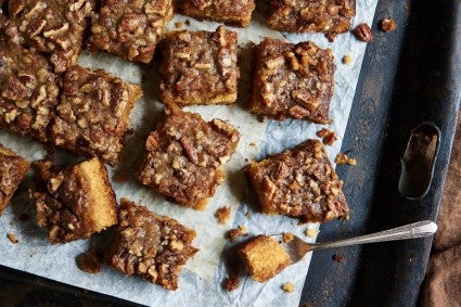 Squares of Farmhouse Buttermilk Cake on a piece of parchment