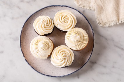 Cupcakes decorated with a classic swirl piped with an open star tip
