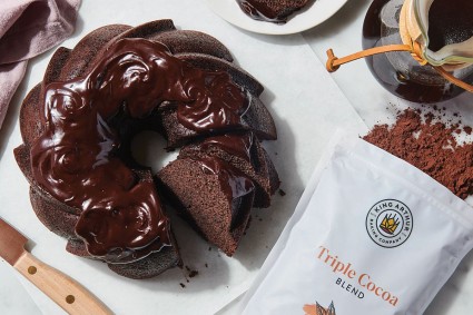 Chocolate Bundt cake next to bag of cocoa powder