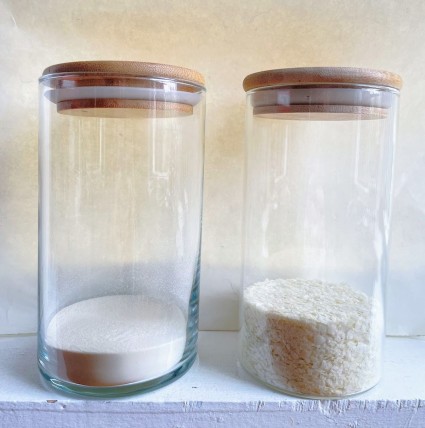 Two clear glass cylinders, one with potato flour, one with potato flakes