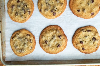 Chocolate chip cookies baked on parchment paper