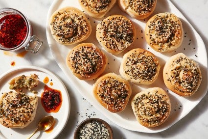Large plate of Tahini-Scallion Rolls.