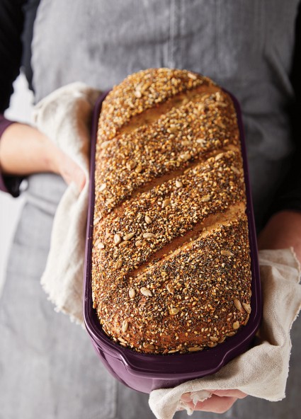 Seed-coated loaf of bread