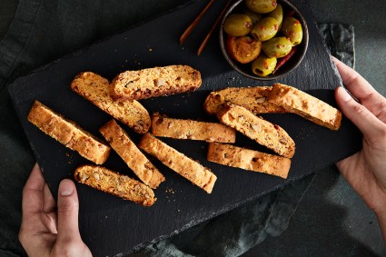 A handful of savory cheese biscotti on a kitchen surface, ready for snacking