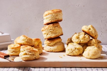 Three styles of biscuits on a cutting board