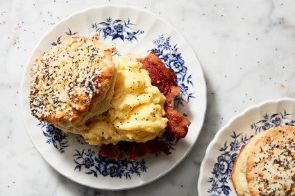 Biscuit made into a breakfast sandwich on a plate. 