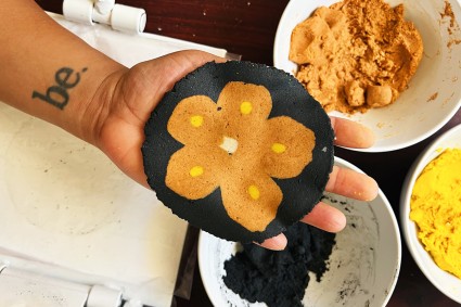 Pressed tortilla with orange flower design