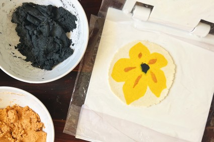 Pressed tortillas with yellow flower pattern