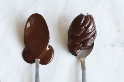Spoonful of smooth melted chocolate next to spoonful of seized melted chocolate