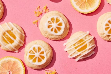 Lemon thumbprint cookies filled with lemon curd and drizzled with lemon glaze
