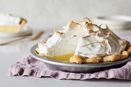 Mile-High Meringue Pie with slice cut out