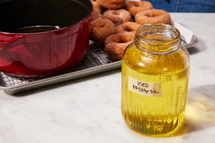 Strained frying oil in a labeled glass jar