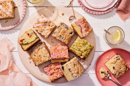 A platter of slices of different berry-flavored coffee cakes