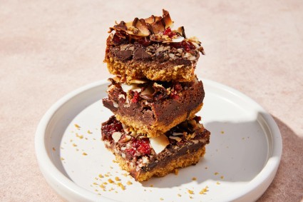 Stack of three magic bars on a white plate. 