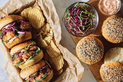 Tray of sandwiches made with potato buns. 