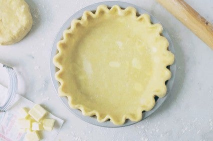 Pie crust shaped and in the pan, ready to fill or prebake.