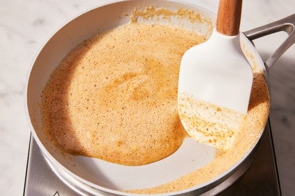 Baker toasting milk power on the stovetop