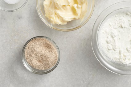 Small bowl of yeast next to other ingredients